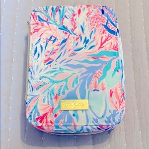 Makeup brush case with brushes.